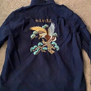 Embroidered back graphic polo button down